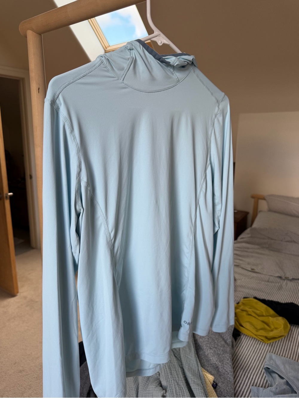 Orvis Light Blue Long-Sleeve Hooded Performance sun shirt.